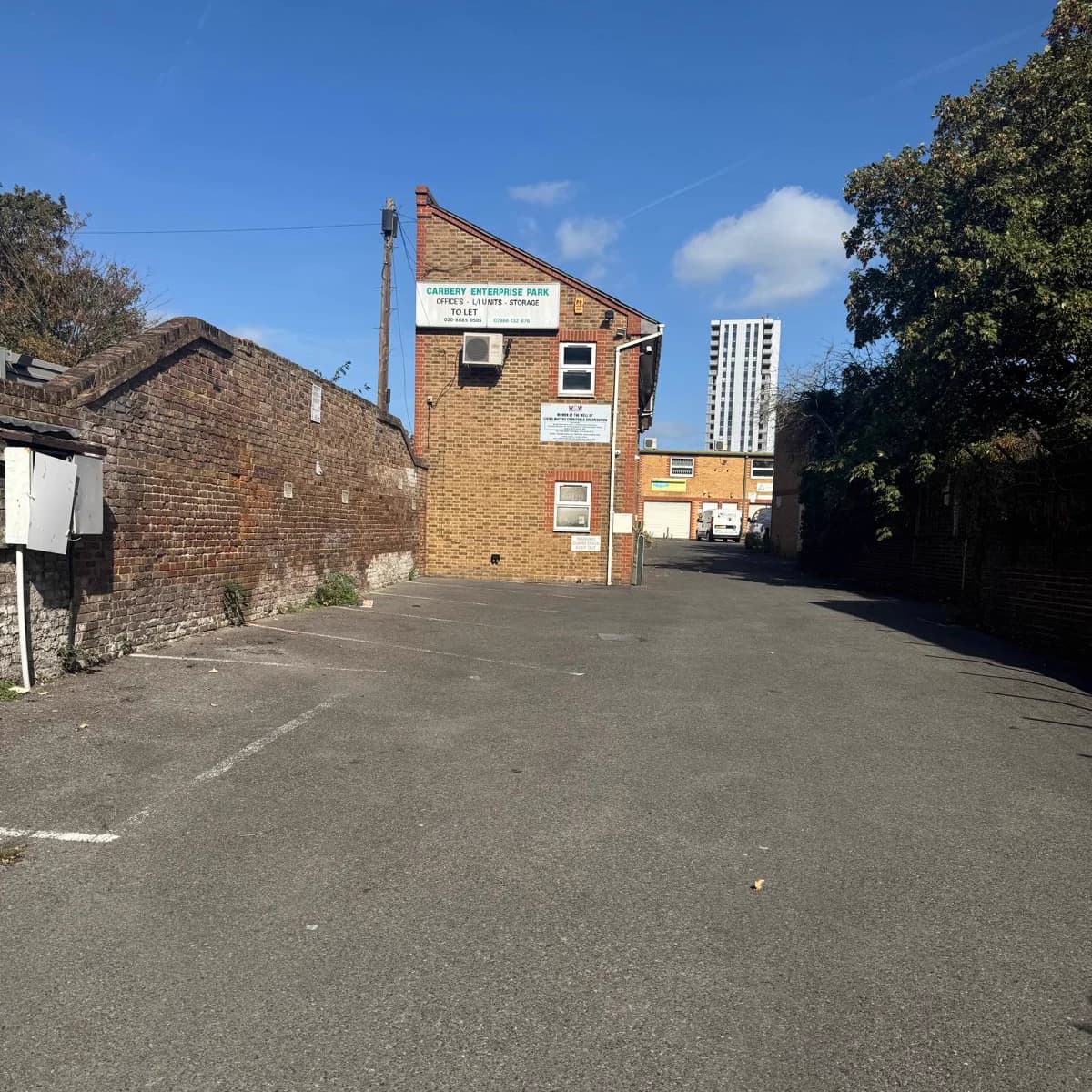 The compound at 36 White Hart Lane — the car park in front of the brick building that holds the worship hall.