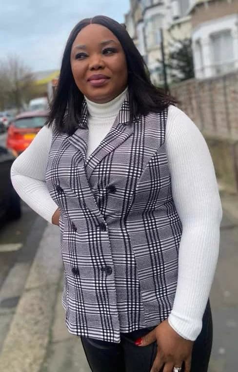 Imaobong Benson, Trustee and Treasurer, photographed on a North London street.