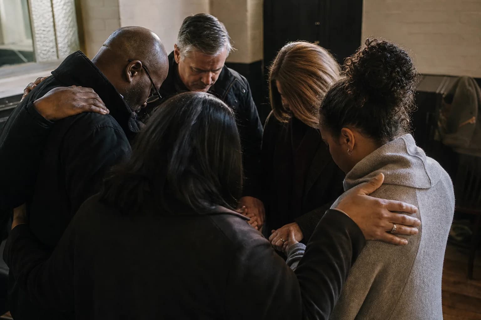 Hands open in prayer during a quiet moment in the service.